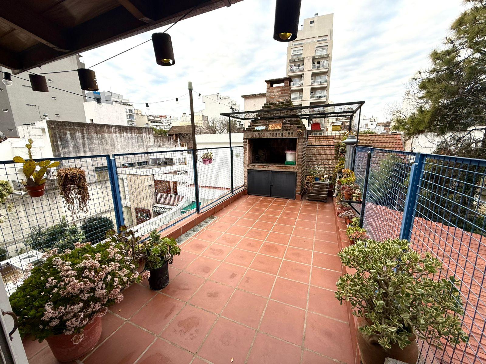 Terraza con parrilla