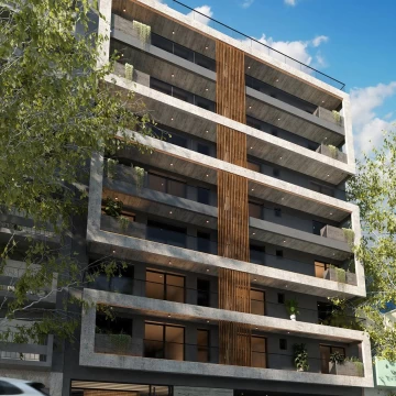Departamento de 4 ambientes con patio y cochera.