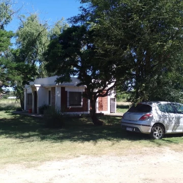 Casa yTerreno lujan sobre ruta 7 barrio esperanza