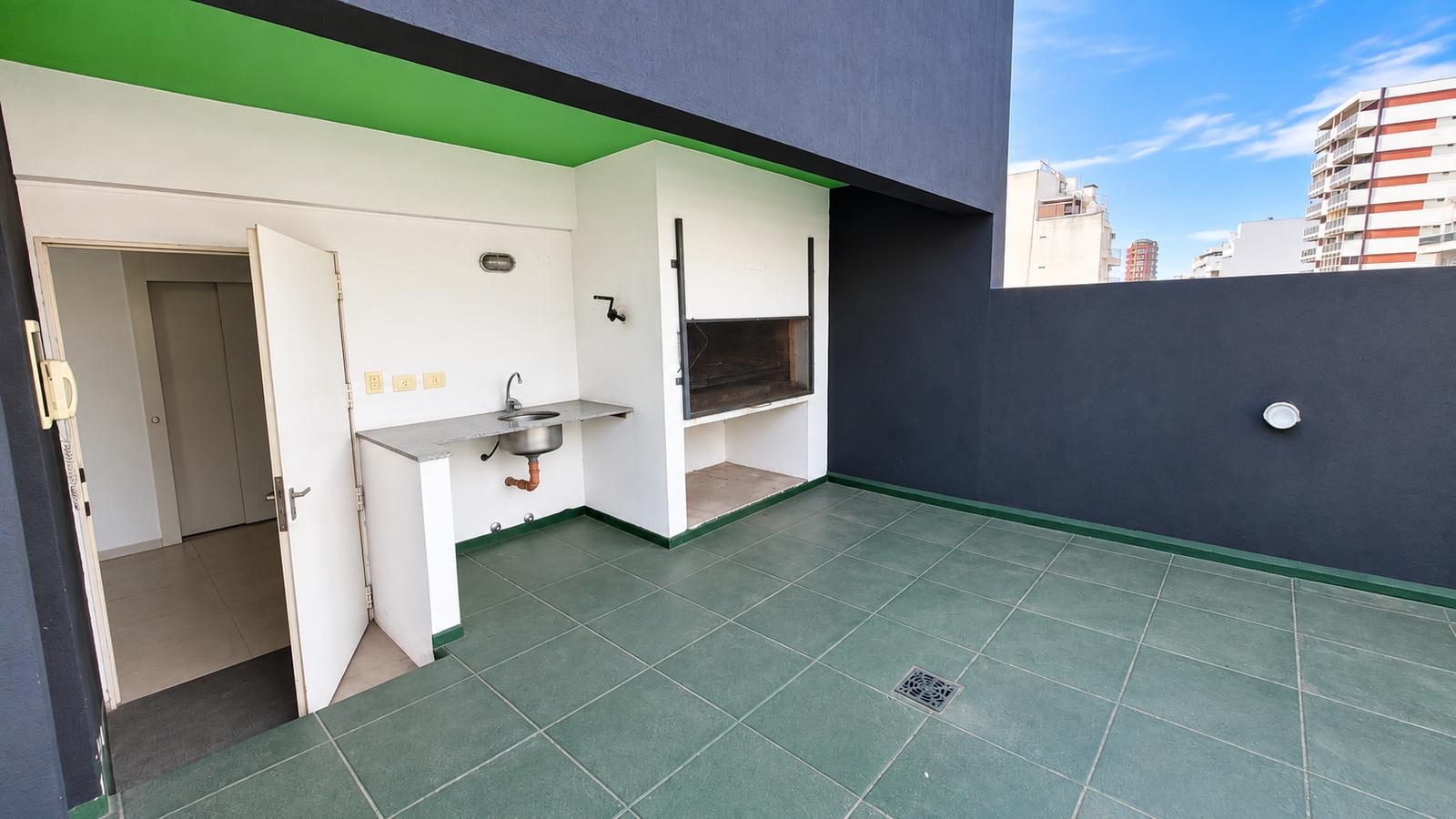 Terraza con parrilla